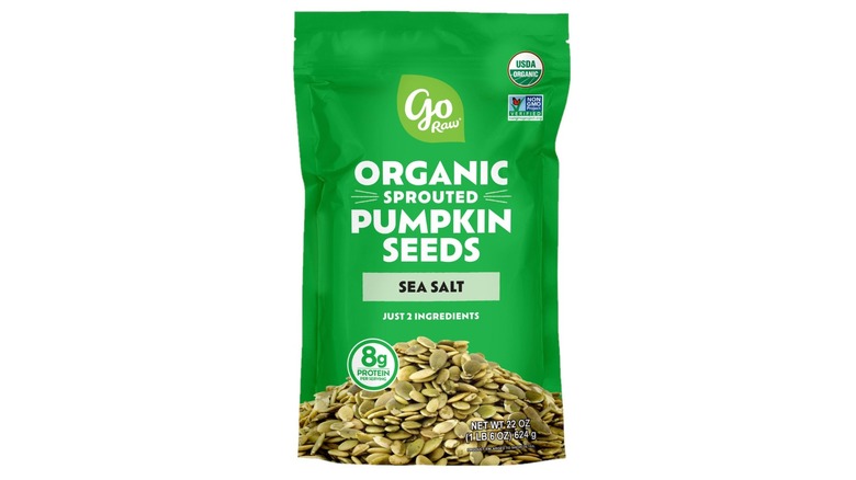 Bag of Go Raw Sprouted Organic Pumpkin Seeds with Sea Salt against a white background.