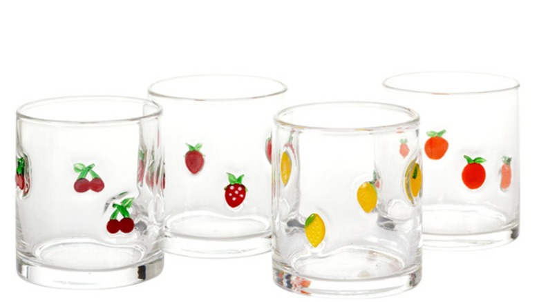 Four glasses with images of fruit