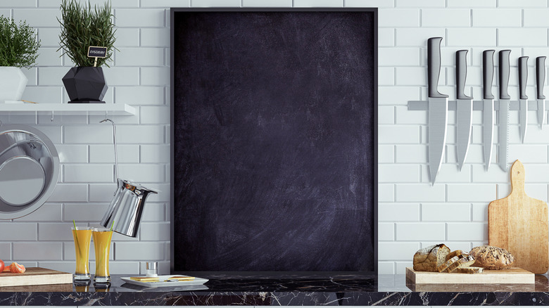 A large chalkboard in a modern kitchen