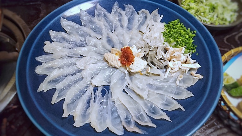 raw fugu on blue plate