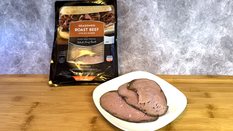 A package and plate of sliced roast beef