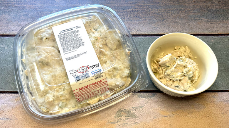 Chicken salad in a plastic package, with a serving in a small bowl