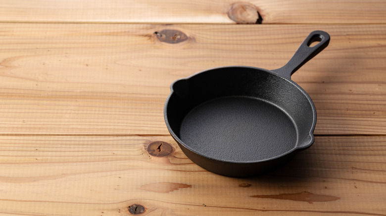 Cast iron skillet on a wooden cutting board