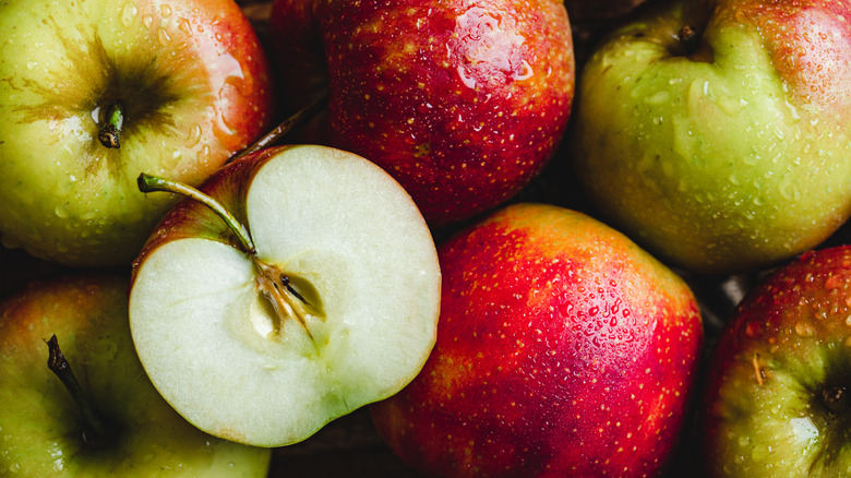 A pile of red and green apples