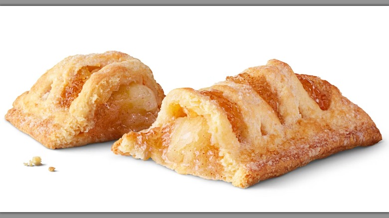 A split-open McDonald's Baked Apple Pie on a white background