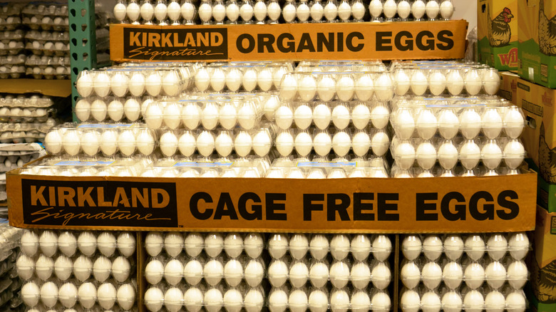 a pallet stacked high with cartons of Kirkland Signature organic and cage free eggs