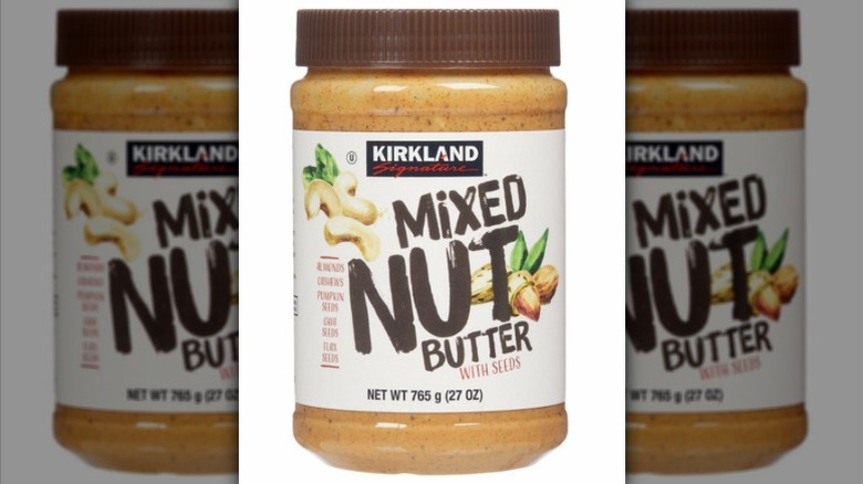 a jar of Kirkland Signature mixed nut butter against a white background