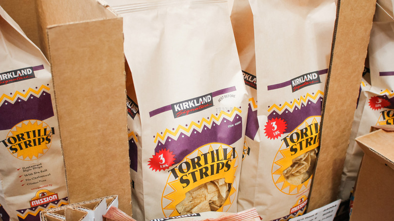 boxes of bags of Kirkland Signature three-pound bags of tortilla strips