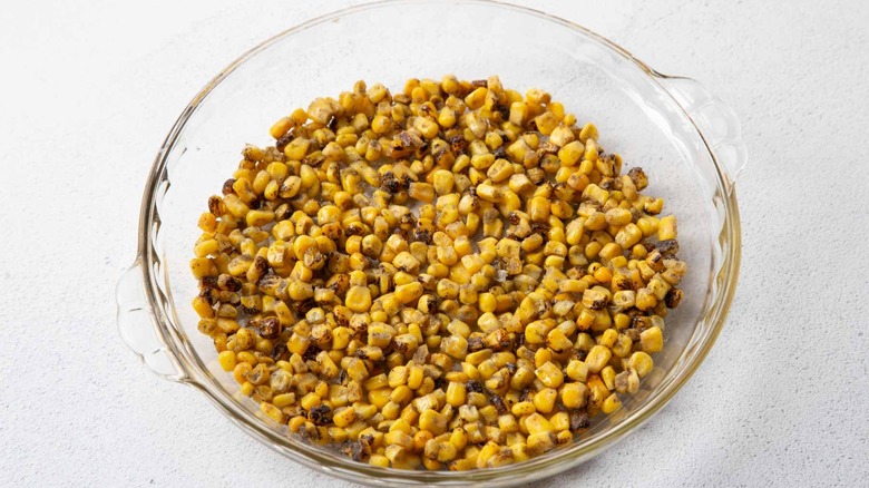corn kernels in a clear pie plate