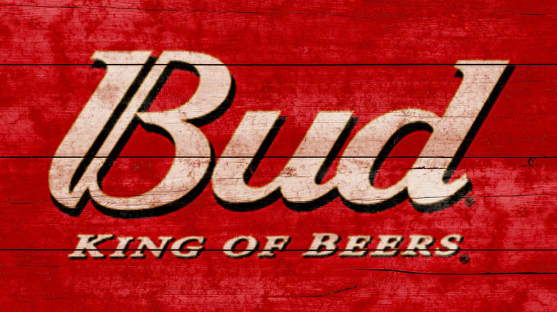 Red painted wooden sign stating "Bud The King of Beers"