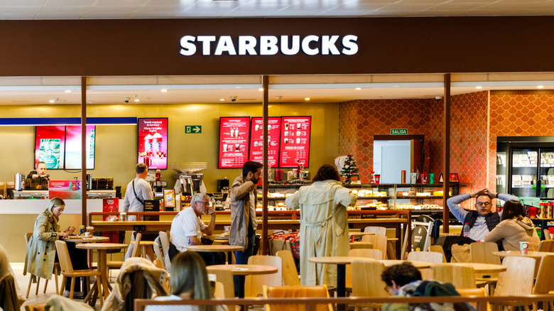 People sitting inside a Starbucks cafe