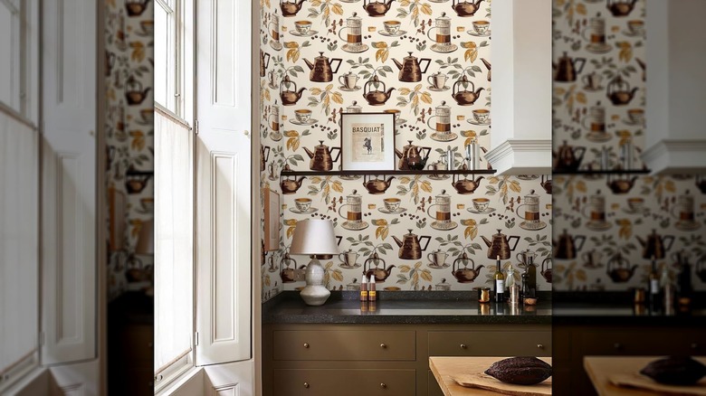 Cream and yellow retro coffee pots wallpaper on a kitchen wall behind a counter
