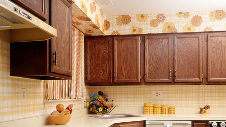 1970s kitchen with yellow floral and striped wallpaper