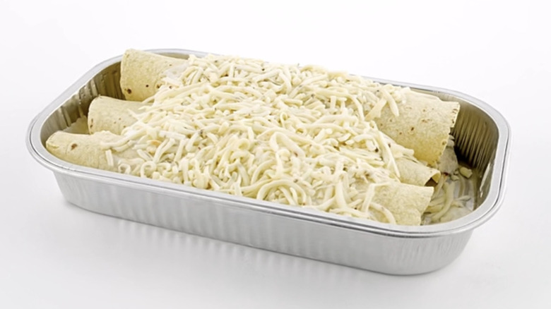 Hatch chili chicken enchiladas in an aluminum pan