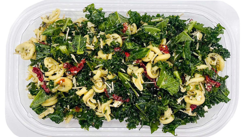 Plastic container of kale pasta salad