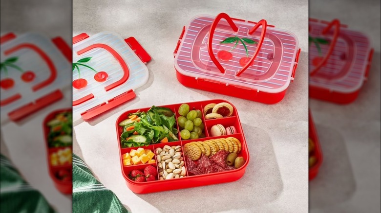 Cherry decorated snack boxes with finger foods inside