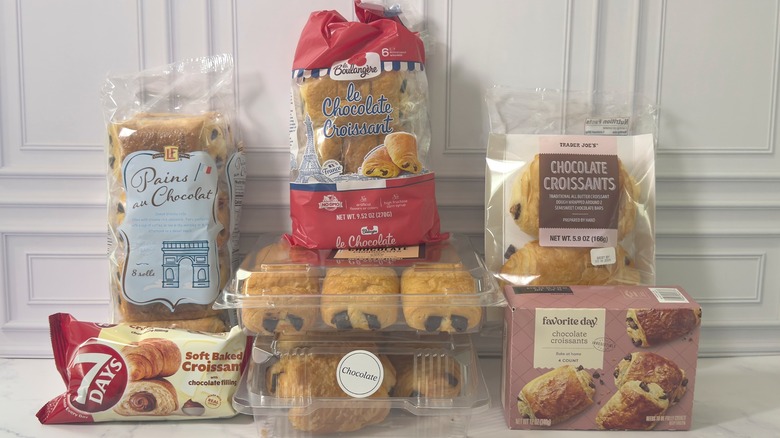 Various packages of chocolate croissants on white background