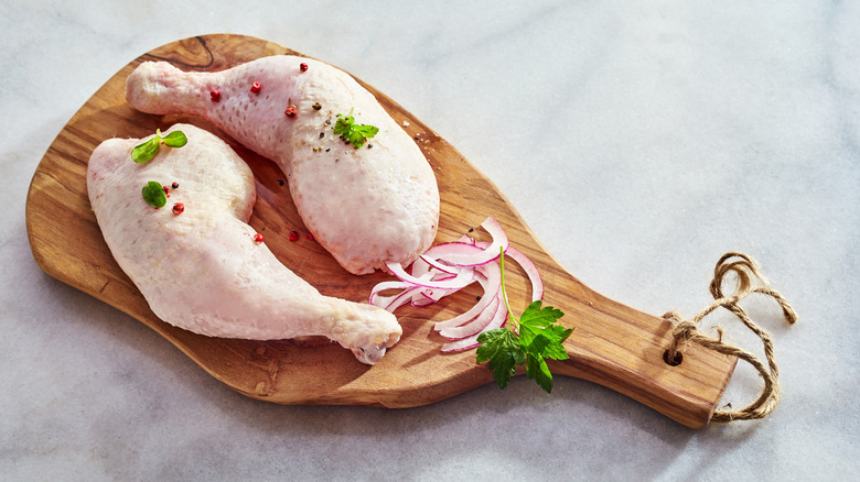 chicken drumsticks on cutting board