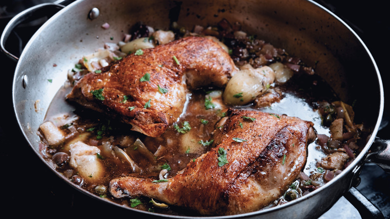 chicken in pan on stove