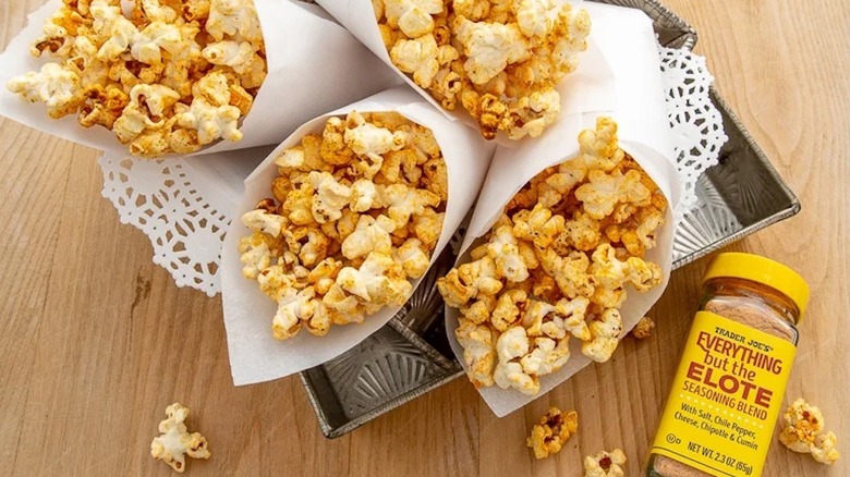 Elote seasoning blend next to seasoned popcorn