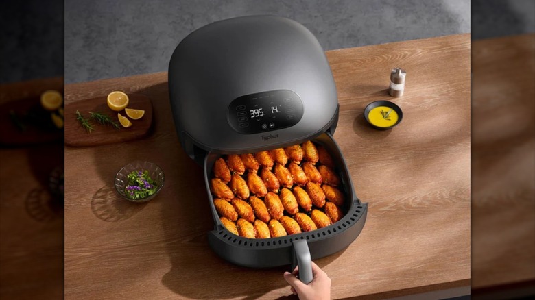 Typhur Dome 2 oven drawer open with chicken wings lined inside
