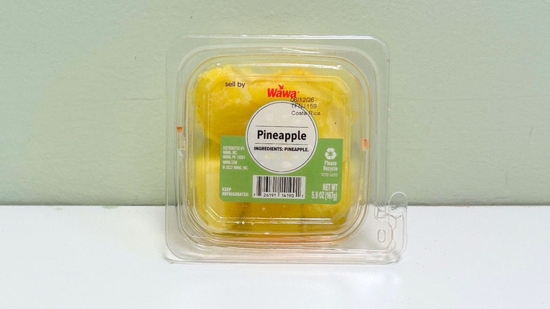 A plastic container of Wawa Pineapple chunks