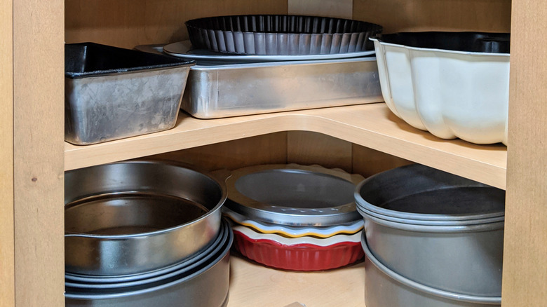 large pans in bottom corner cabinet