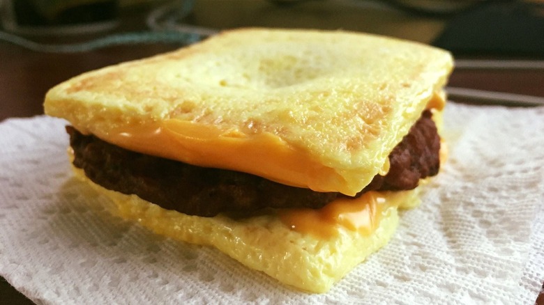 A breakfast sandwich with two egg patties as the bun