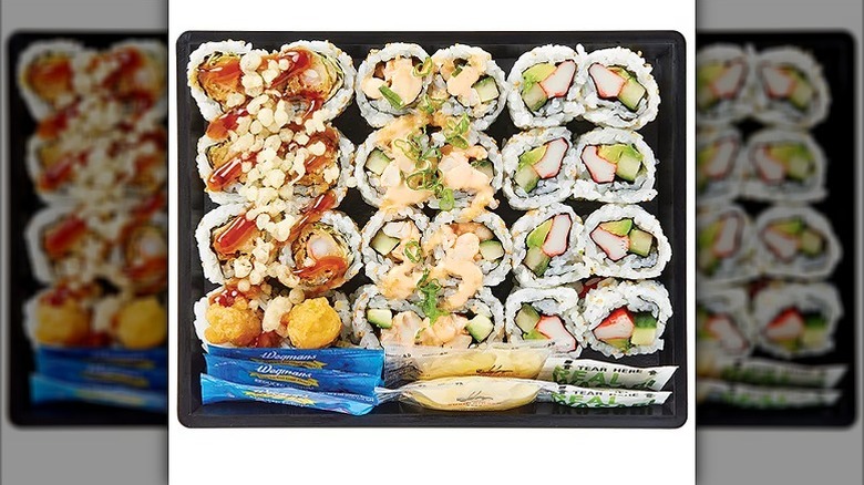 a family pack with 24 piece of sushi and 6 packets of soy, ginger, and wasabi