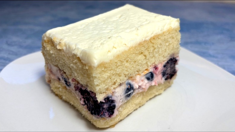 slice of two layer berry vanilla cake