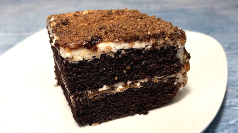 slice of two layer chocolate caramel cake