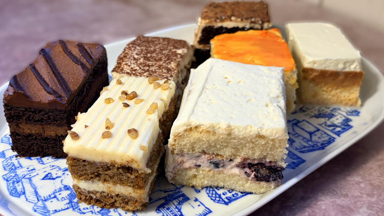 various slices of cake arranged on platter