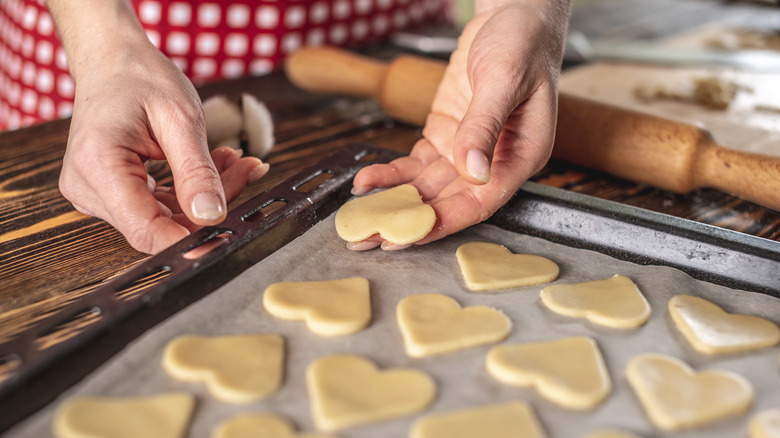 heart cookies placed on a baking sheet