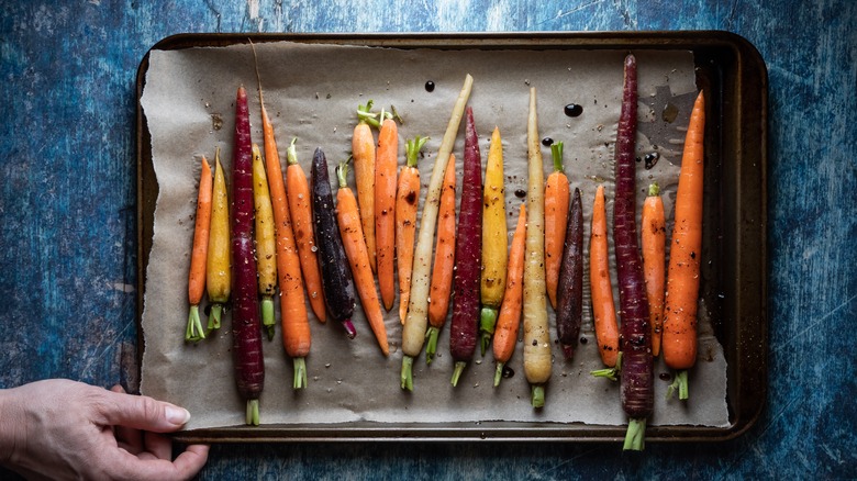 colorful carrots on a baking sheet