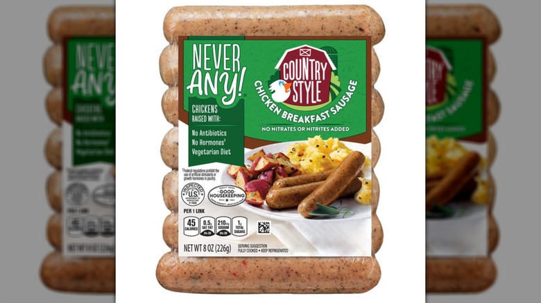 A package of Aldi's Never Any! Country-Style Chicken Breakfast Sausage on a white background
