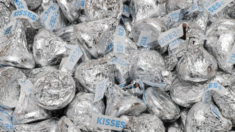 A carboard box full of Hershey's kisses