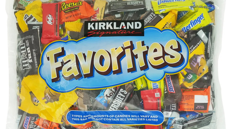 A clear bag of Kirkland Signature All Chocolate selection with mini Reese's, M&M's, Twix, and Snickers visible