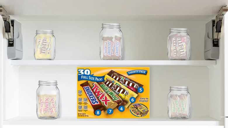 A box of 30 full sized Mars brand chocolate bars in a cupboard