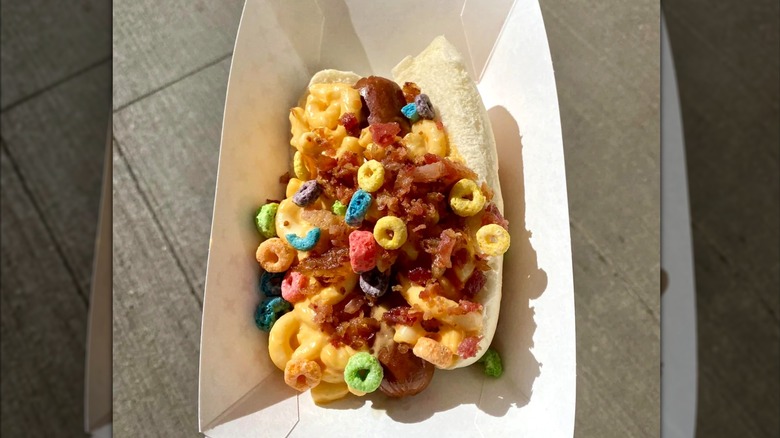 top down view of slider dog with mess of toppings