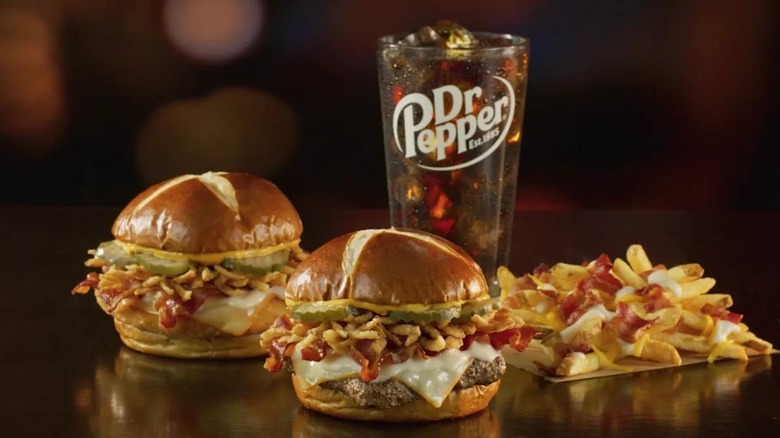 Two Wendy's pretzel bacon pub cheeseburgers with pub fries and a Dr. Pepper
