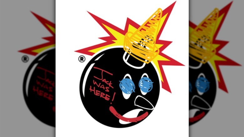 A cartoon black bomb with a face drawn to feature the blue eyes and red smile of Jack In The Box's logo