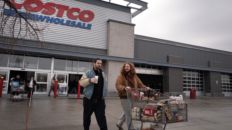 Customers walk out of a Costco store
