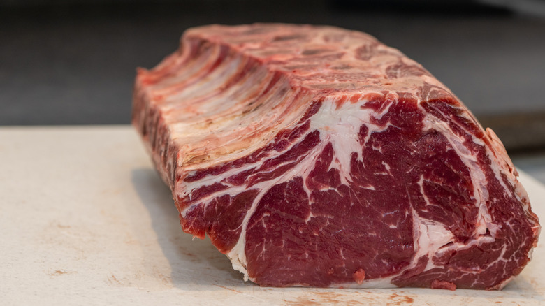 Uncooked prime rib on a counter