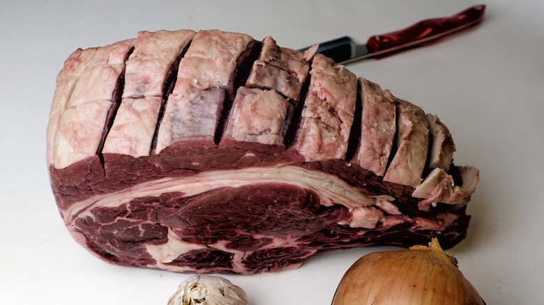 prime rib with slits carved on surface