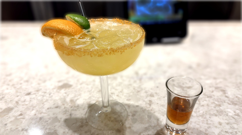 olive garden italian margarita with side shot of amaretto on bar counter
