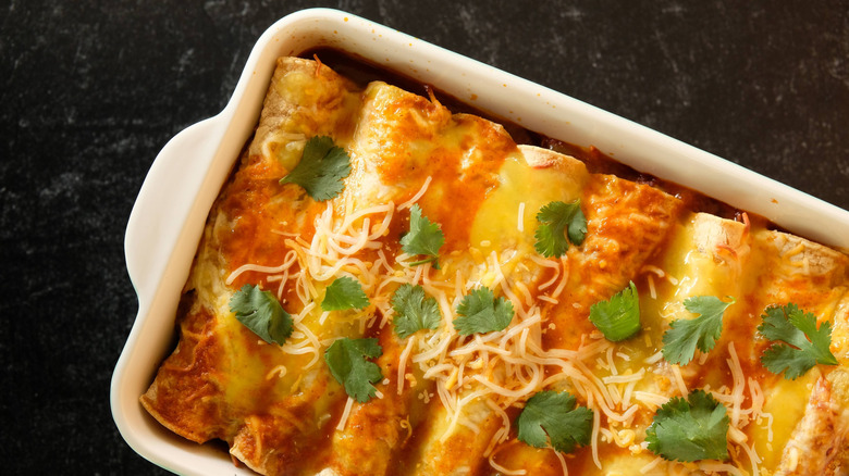 Overhead view of enchiladas in a casserole dish