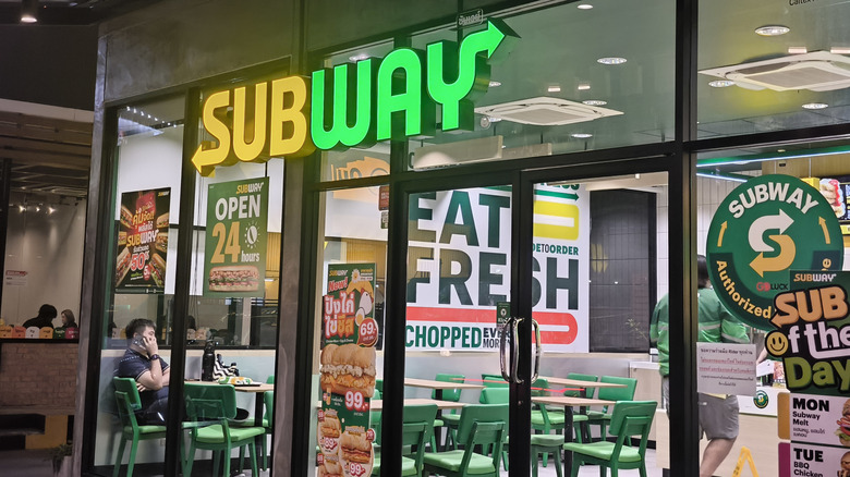 Subway storefront with "Eat Fresh" sign below logo