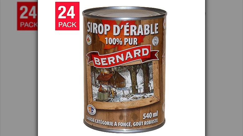 A tin of Bernard maple syrup with the label showing a snowy Canadian woodland scene and the words "100% pur."