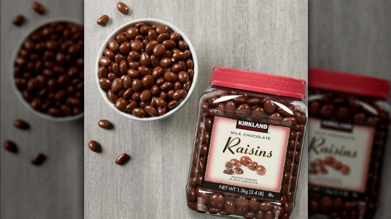 Kirkland milk chocolate raisins in bowl next to container