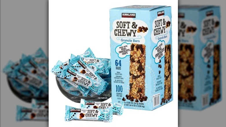 Kirkland chocolate chip granola bars in a box and in a bowl on white background
